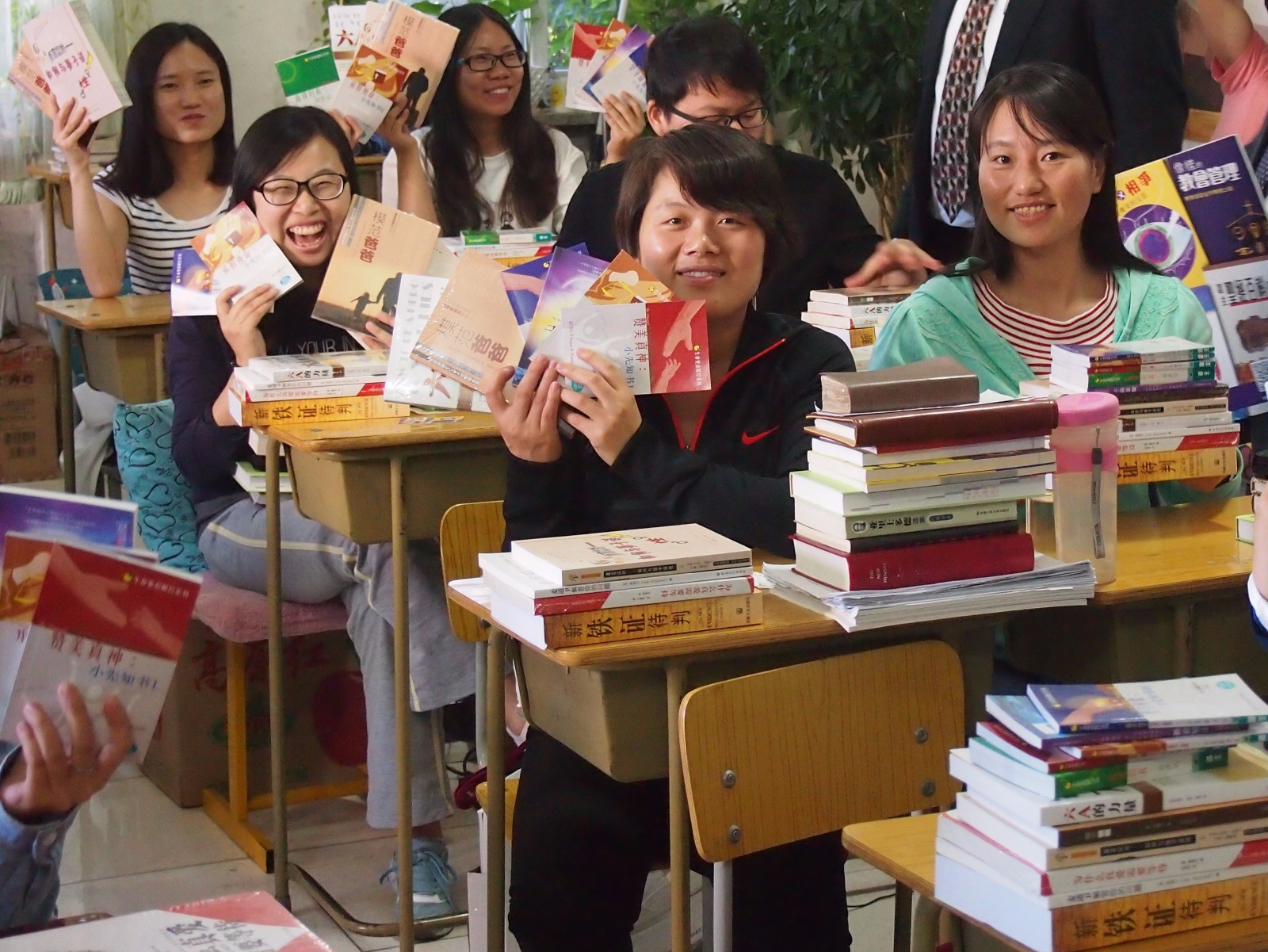 graduates with books